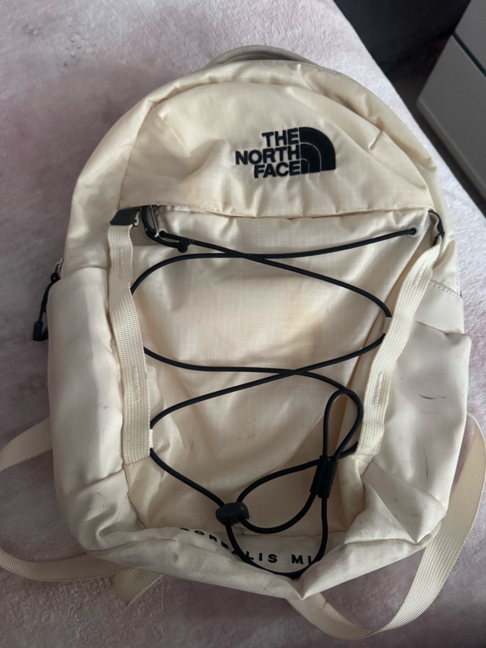The North Face Cream Backpack with Black Bungee
